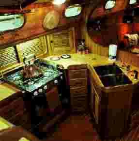 The "U-shaped galley, with large counter area, deep double stainless
    steel sinks with abundant drawers and lockers create the ultimate area to prepare meals.
      The large…