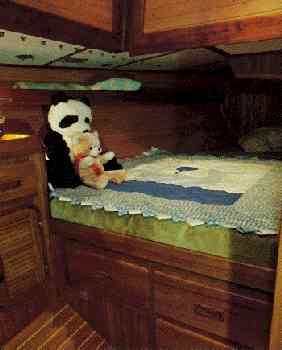 The V-berth of the Baba 40 is a large double stateroom with its own
    stowage and hanging lockers and there is another large stateroom aft.