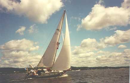 This is a picture of Nightwinds , a Baba 30, under full sail on a
postcard-perfect day.