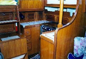 The galley is located on the port side, aft. A double sink, gimbaled
stove with oven and large, well insulated are common on most Baba 30s.